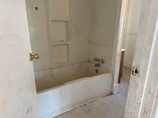 bathroom with vanity, shower / bathtub combination, and tile patterned floors