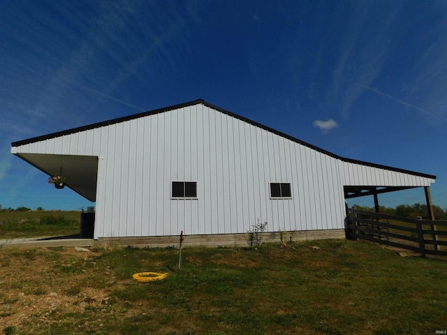 view of outbuilding featuring a lawn