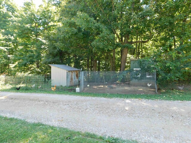 exterior space featuring a shed