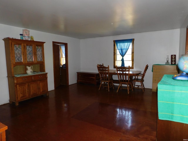 dining space featuring dark wood-type flooring