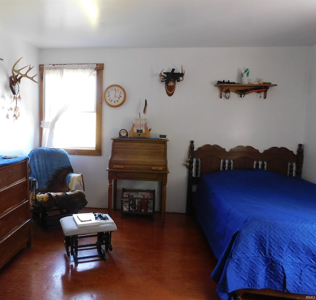 bedroom featuring dark hardwood / wood-style flooring