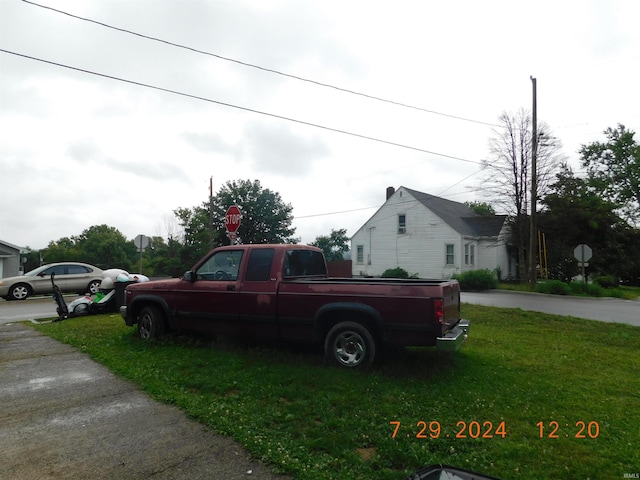 view of property exterior with a lawn