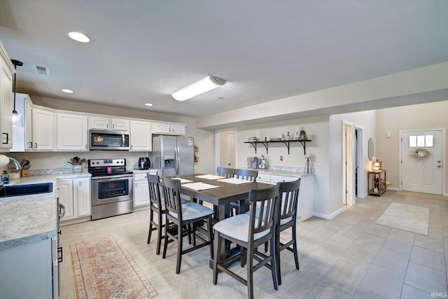 dining space featuring sink