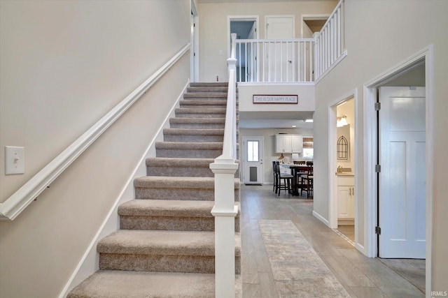 stairway with a towering ceiling