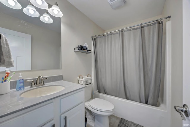 full bathroom with shower / bath combo with shower curtain, vanity, and toilet