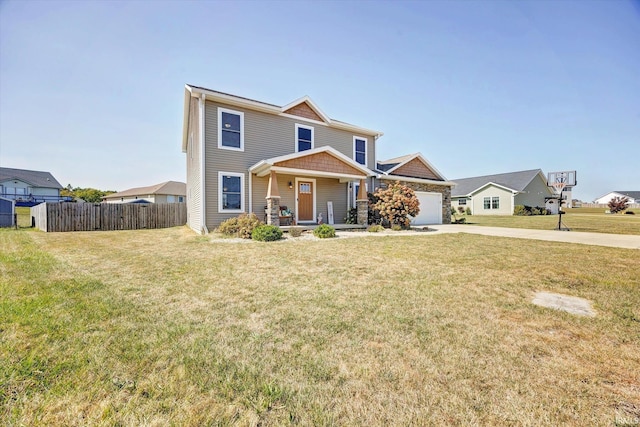 view of front of property featuring a garage and a front lawn