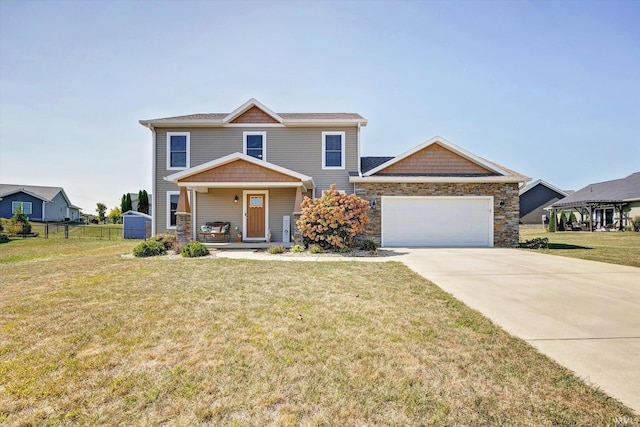 craftsman inspired home with a garage, a porch, and a front lawn