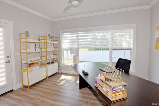 home office with baseboards, crown molding, a ceiling fan, and wood finished floors