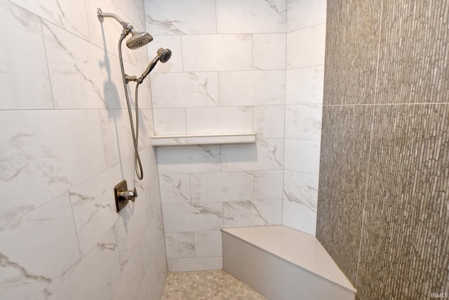 full bath featuring tiled shower