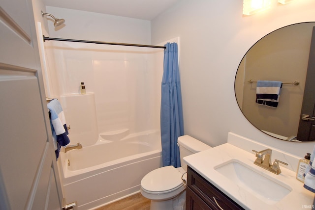 full bath with vanity, toilet, wood finished floors, and shower / bath combo with shower curtain