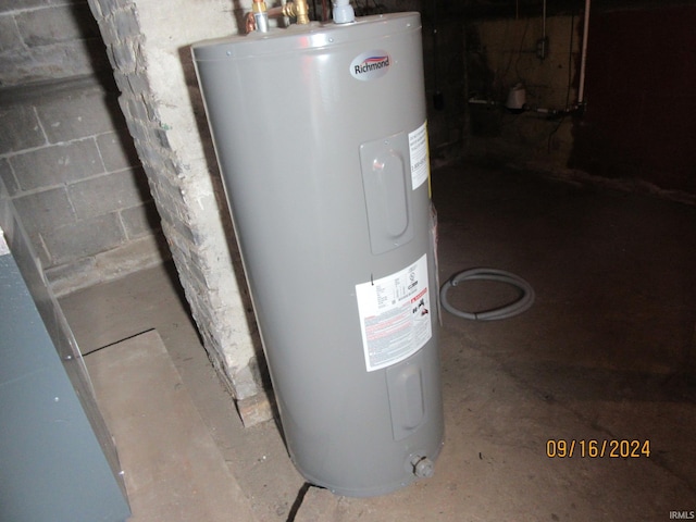 utility room with electric water heater