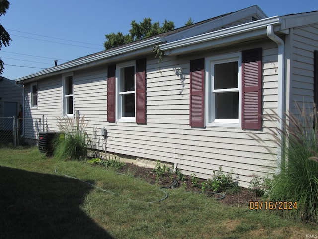 view of home's exterior with a lawn