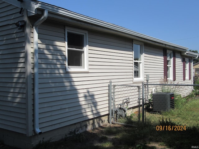 view of side of home with cooling unit