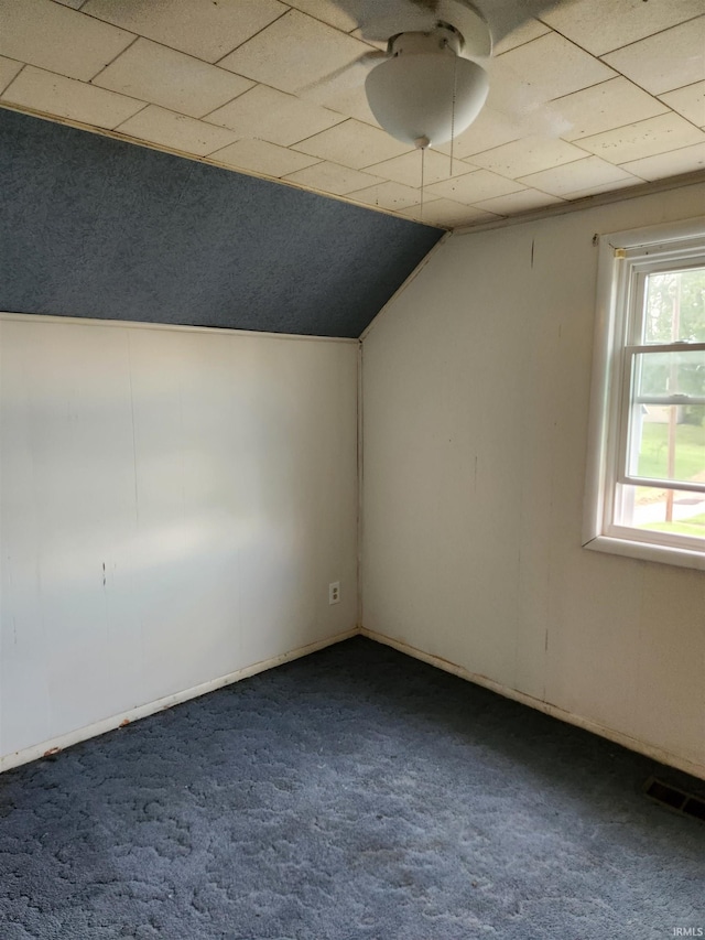 bonus room with ceiling fan, lofted ceiling, and carpet flooring