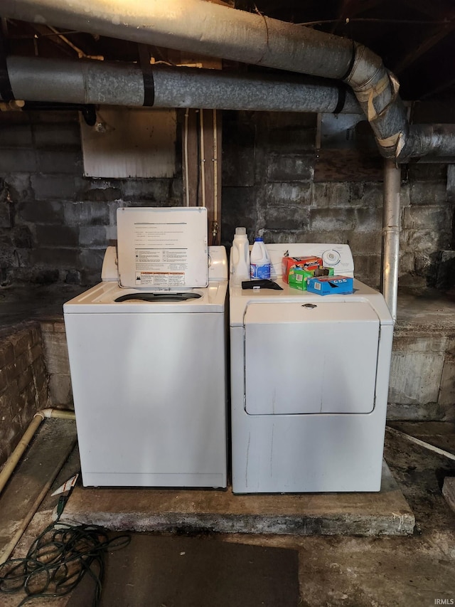 clothes washing area featuring washer and dryer