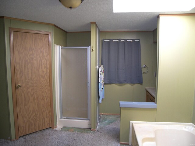 bathroom featuring vanity, a textured ceiling, and an enclosed shower