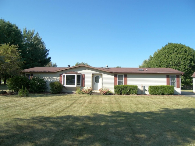 ranch-style home with a front yard