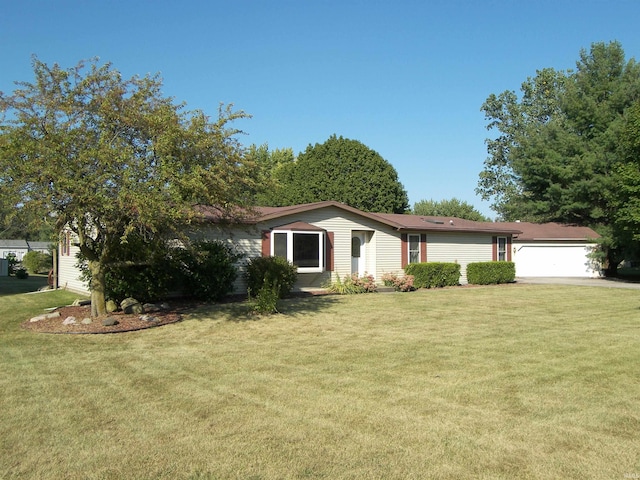 single story home featuring a front yard and a garage