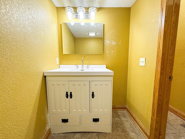 bathroom with tile patterned flooring and vanity