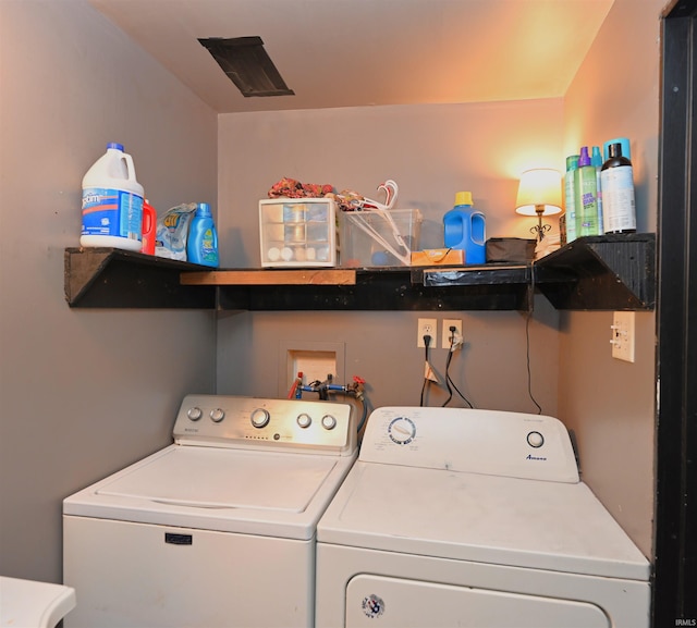 washroom with washer and dryer