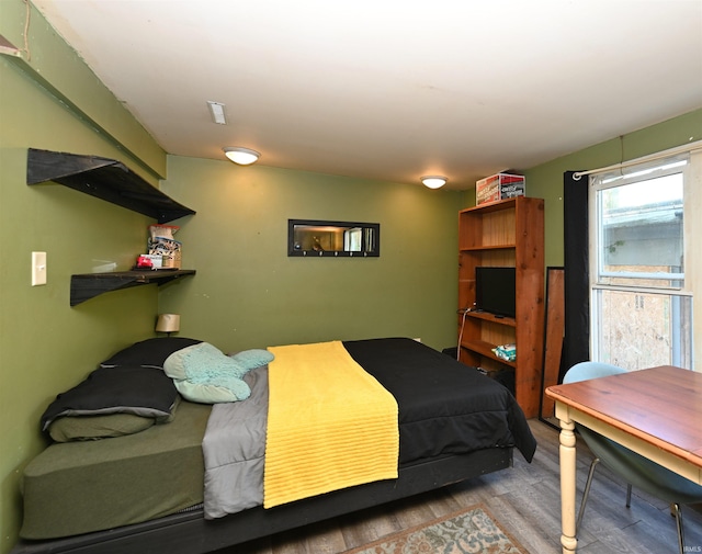 bedroom with light wood-type flooring