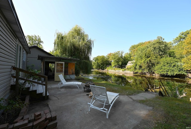 view of patio / terrace with a water view