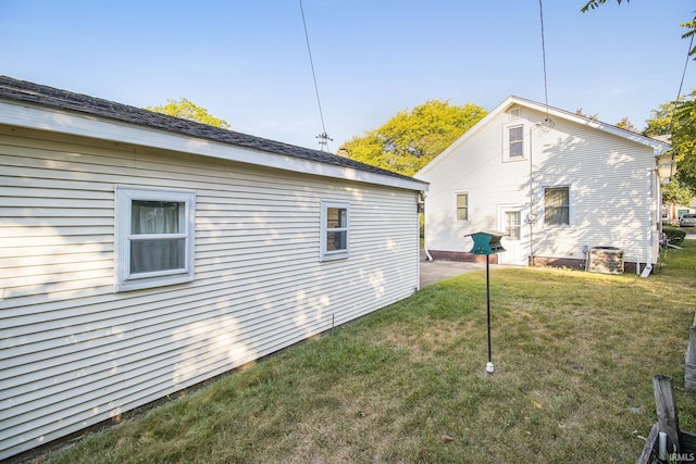 rear view of property with a lawn