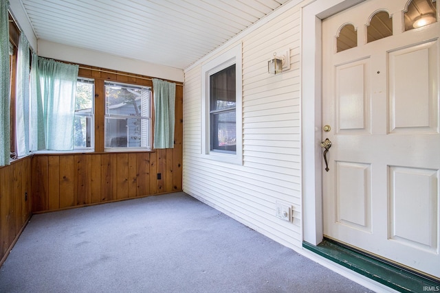 unfurnished sunroom featuring wooden ceiling