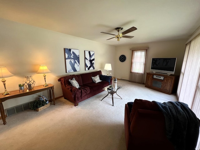 living room featuring ceiling fan and light colored carpet