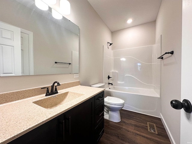 full bathroom featuring wood-type flooring, vanity, toilet, and  shower combination