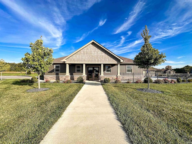 craftsman inspired home with a front yard