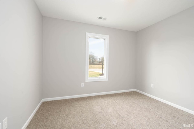 unfurnished room featuring carpet flooring