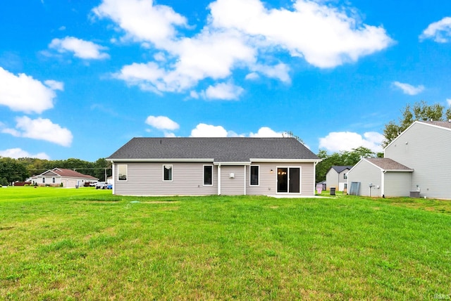 back of house with a yard