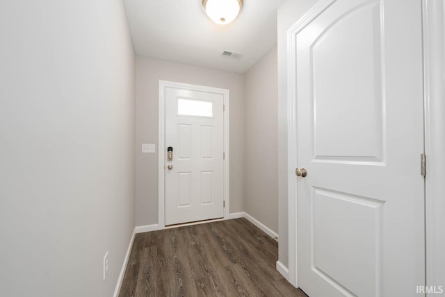 doorway to outside featuring dark hardwood / wood-style floors