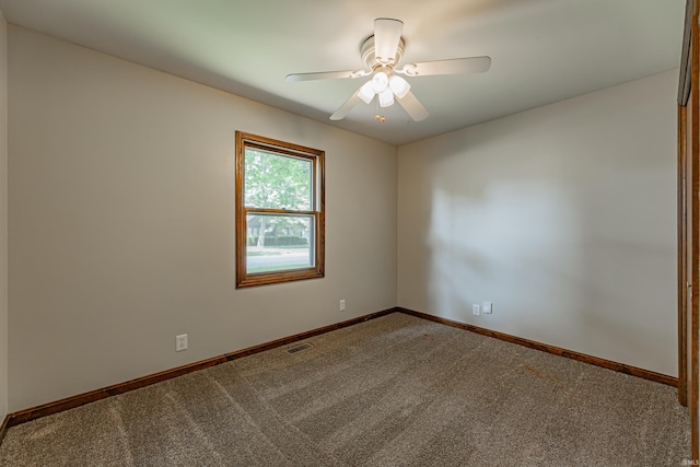 empty room featuring ceiling fan and carpet floors