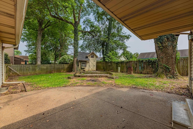 view of patio featuring a shed