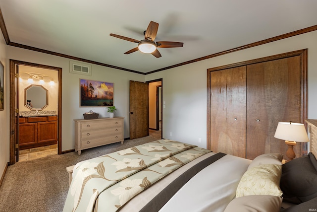 bedroom featuring dark carpet, ceiling fan, a closet, crown molding, and ensuite bathroom