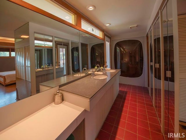 bathroom with vanity and tile patterned floors