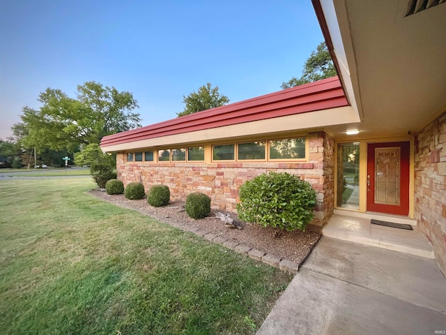 exterior space with a lawn