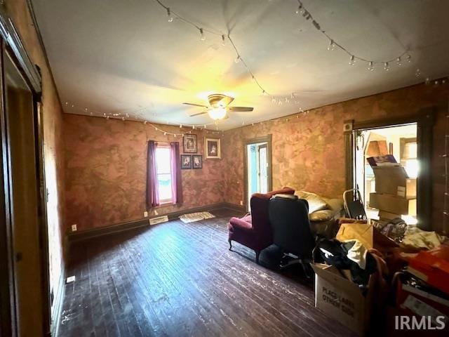 interior space with dark hardwood / wood-style flooring and ceiling fan