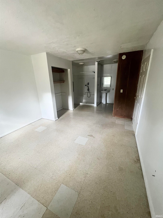 unfurnished living room with a textured ceiling