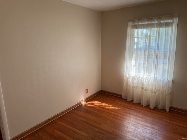 spare room featuring hardwood / wood-style flooring