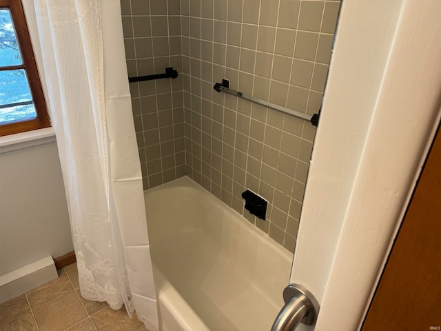 bathroom featuring shower / tub combo with curtain and tile patterned flooring