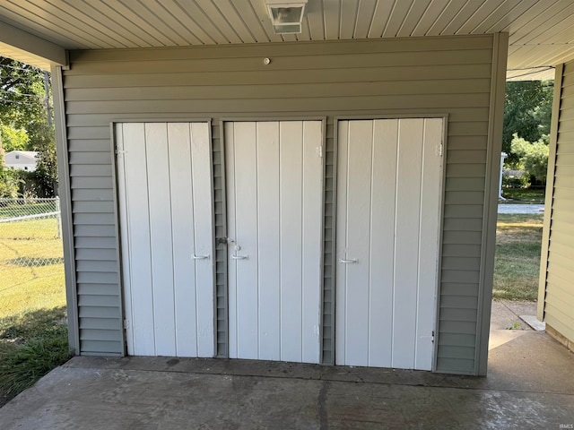 garage with wooden ceiling and wood walls