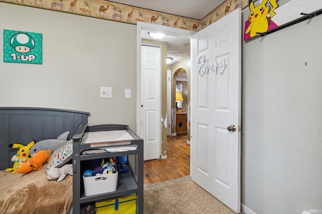 bedroom with hardwood / wood-style floors