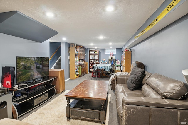 carpeted living room with a textured ceiling