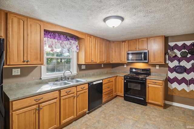 kitchen featuring a textured ceiling, sink, and black appliances