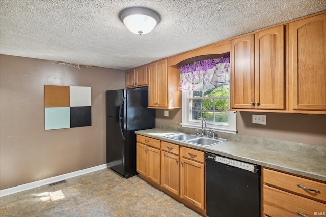 kitchen with a textured ceiling, black appliances, and sink