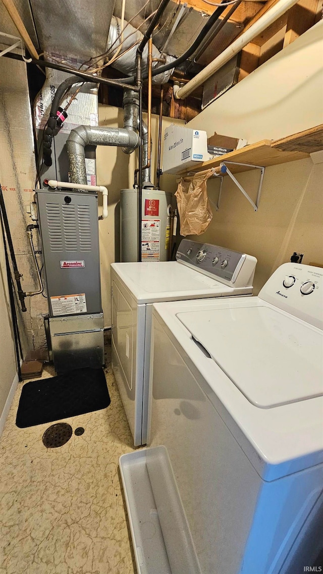 laundry room featuring separate washer and dryer and gas water heater