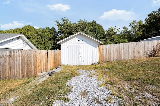 view of outbuilding featuring a yard